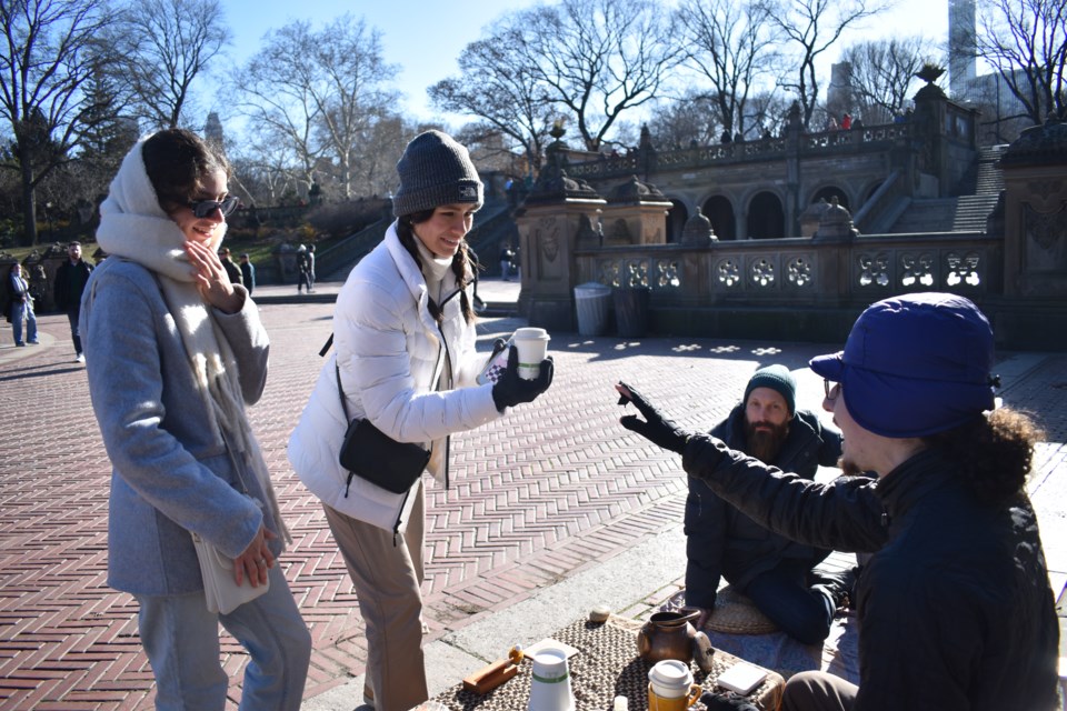 Two tourists from Mexico being served tea at The Stand