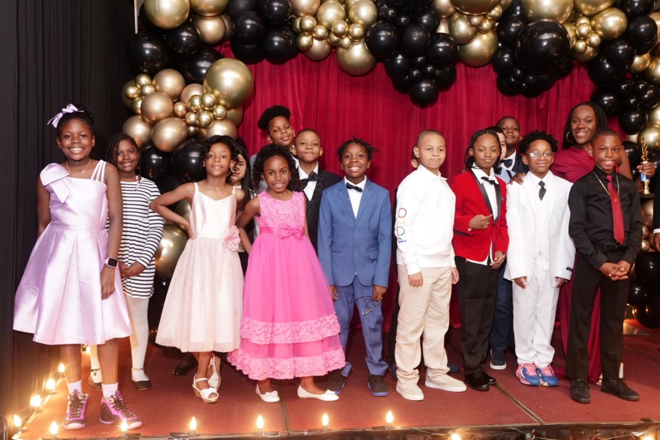 Brittney Barriteau, a teacher at P.S. 5 (far right), and her 4th grade student creators of The STEMMY Awards.