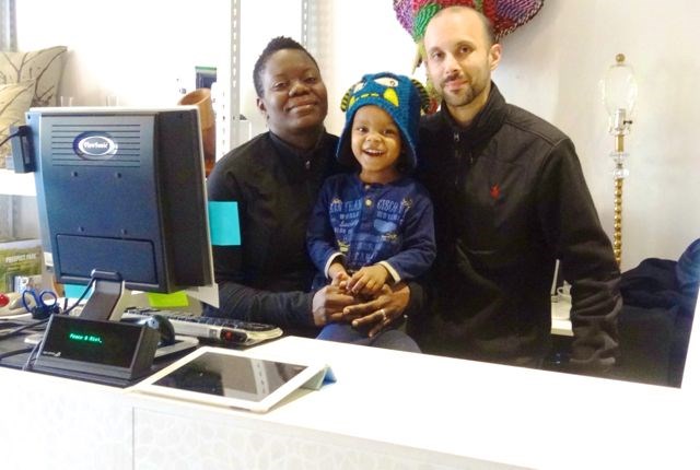 Husband-and-wife team Achuziem Maha-Sanchez and Lionel Sanchez, owners of peace & RIOT, with their son