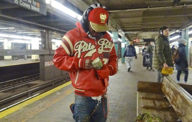 Meet Jihad or "J," who we spotted at Hoyt-Schermerhorn waiting for the A train. He had on a red jacket, chain, gloves, shoes and made a point to pull out a red cell phone. He was certainly matching. He says he produces music.