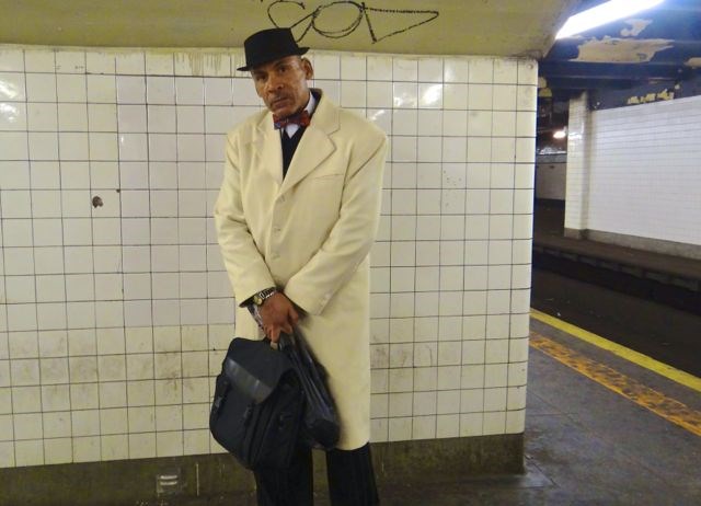 This is Brother Rahmel. We spotted him waiting for the G train, dressed sharply in a white cashmere coat, complete with a red bow tie. "I'm a Muslim," he said proudly. "I follow the teachings of the Honorable Minister Louis Farrakhan."