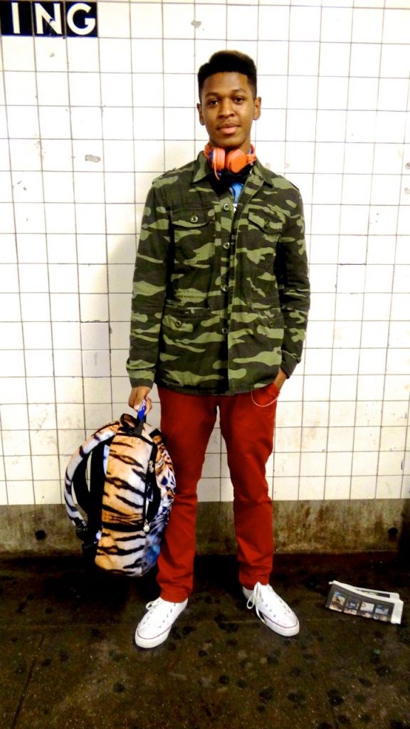 This friendly teen was just leaving school. We caught him waiting for the C train. He stood out from the rest of his schoolmates because he definitely was unafraid of showing his fashion sense through patterns and colors.