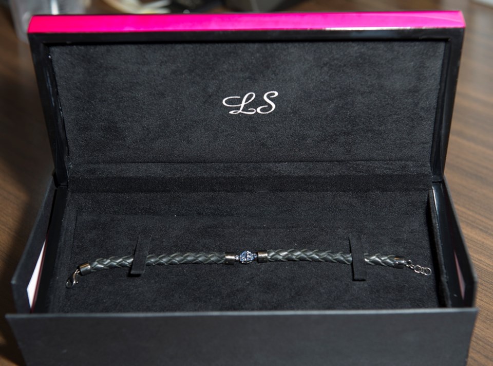 Lorraine Schwartz designed leather bracelet with two interlocking blue sapphire B's, for Beyoncé and Blue Ivy