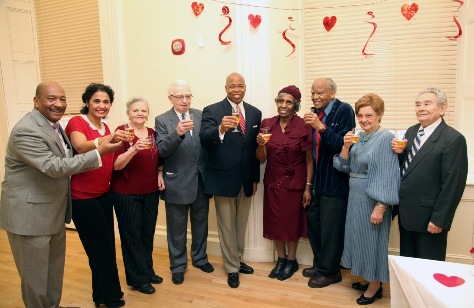 Brooklyn Borough President Eric Adams offers a sparkling cider toast during his Sweethearts celebration in honor of Valentine?s Day at Borough Hall; he is joined by (from