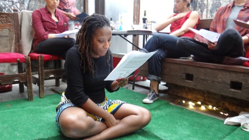 Brittanie Richardson sits with the "Art and Abolition" family in Brooklyn, organizing roles and a fundraising initiative before her trip back to Kenya.