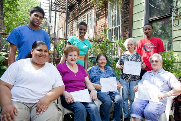 Seniors show their certificates after completing a MAZii Intergenerational Learning Program