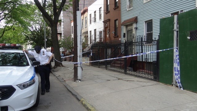 Police tape off house where witness say argument started in front of 219 Spencer Place