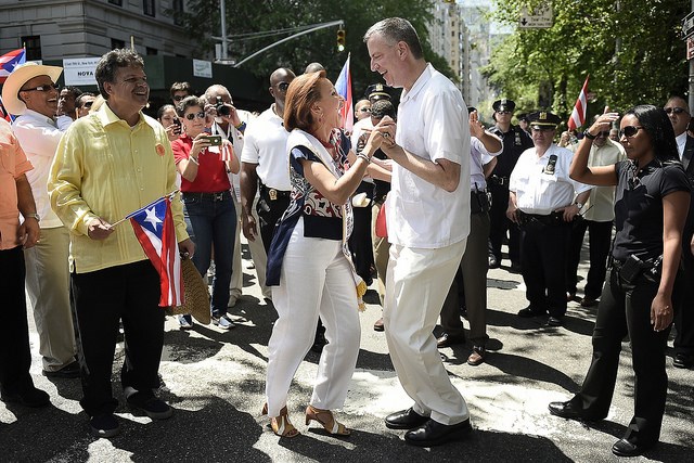 Mayor Bill de Blasio dances with Congresswoman Nydia Velázquez at the Puerto Rican Day Parade on Fifth Avenue on Sunday, June 8, 2014. Credit: Diana Robinson for the Office of Mayor Bill de Blasio