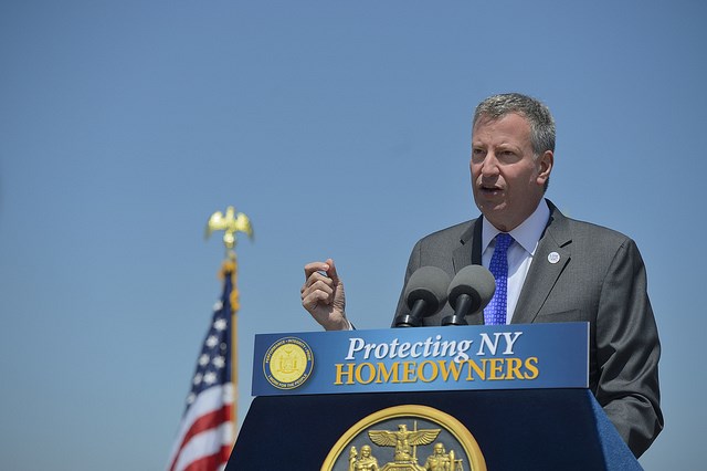 Governor Andrew M. Cuomo signs legislation proposed by Mayor Bill de Blasio to provide relief to homeowners with properties damaged by Superstorm Sandy on Thursday, May 29, 2014. Photo: Rob Bennett for the Office of Mayor Bill de Blasio