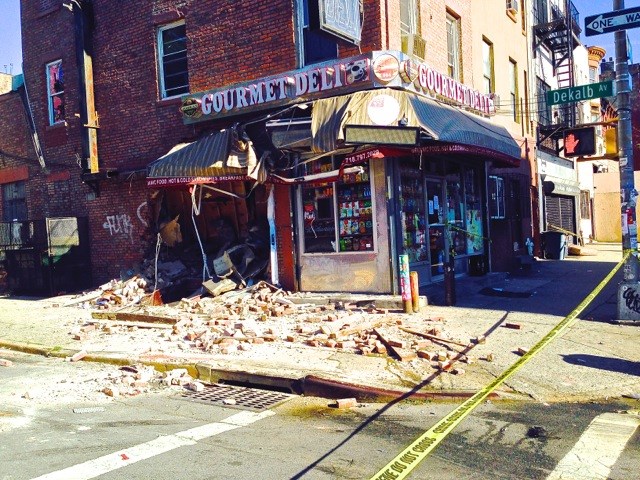 A recycling truck crashes into Gourmet Deli at 944 Bedford Avenue, the corner of Dekalb Avenue