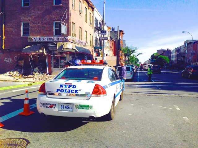 A recycling truck crashes into Gourmet Deli at 944 Bedford Avenue, the corner of Dekalb Avenue