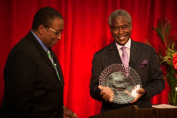 Ippies MC Randall Pinkston delivers the Lifetime Achievement Award to Essence Communications Co-founder Edward Lewis Photo: Brock Stoneham