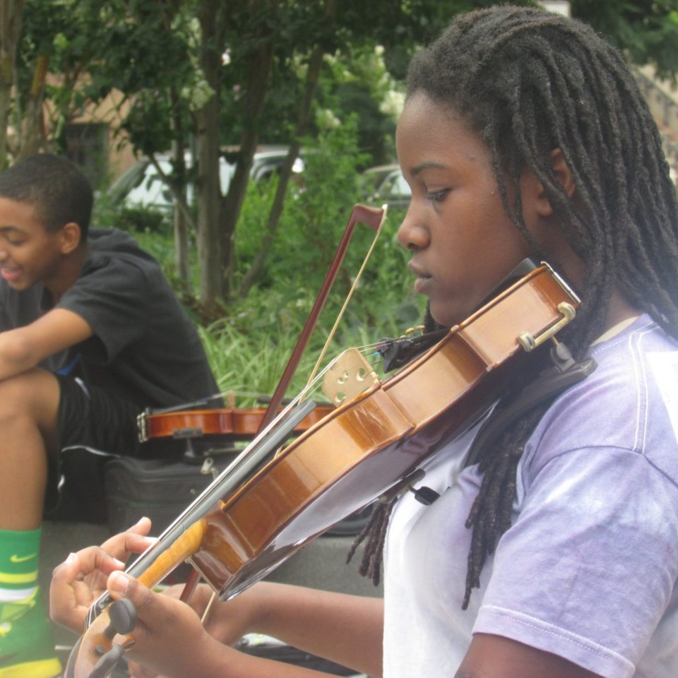 Noel Pointer Foundation Youth String members play at the Marcy Plaza Farmers Market Opening Day, July 16, 2014