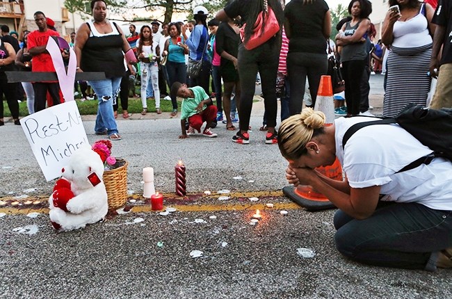 A mourner at the site of Michael Brown's shooting death