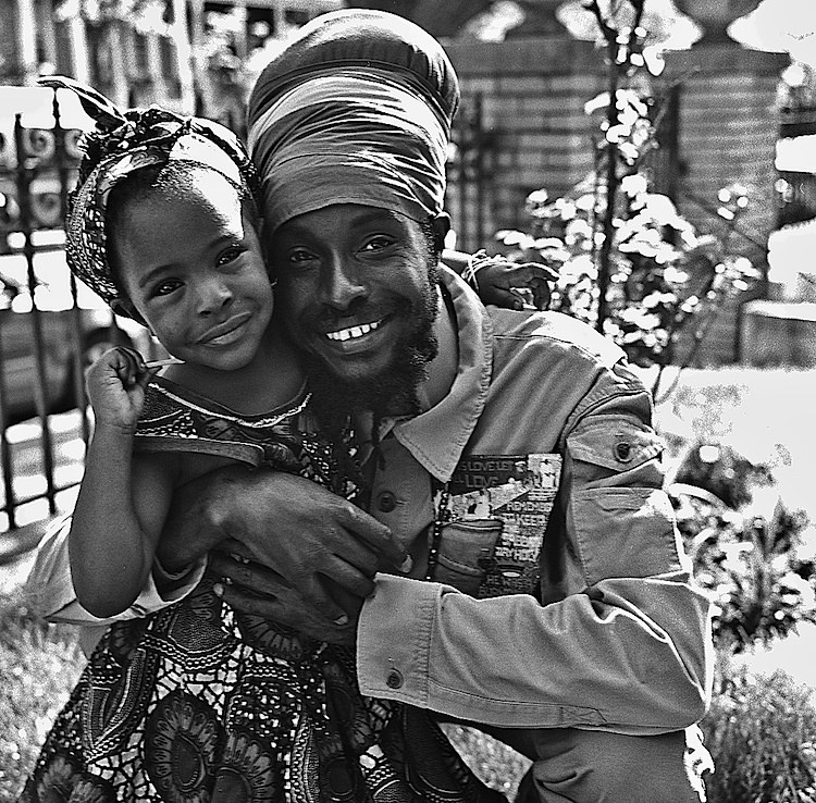 Spring, 2014 -- King Lion Boboshanti and his daughter Queen Omenga pose for a portrait at a Mother's day event at the Akawabaa Mansion in Bed Stuy. King Lion is a Vegan raw food chef from Jamaica. Photo: Russell Frederick
