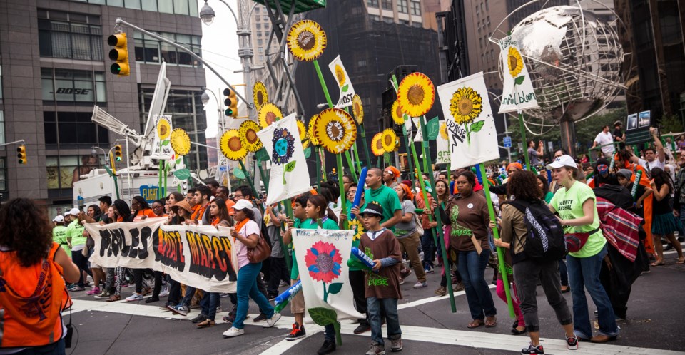 People protest for greater action against climate change during the People's Climate March on September 21, 2014 in New York City. Photo: q13fox.com