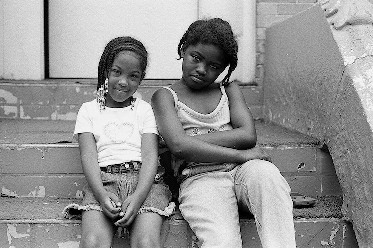 Summer, 2003 -- Two friends pose for a picture on Throop Ave right before they are told to come upstairs. Photo: Russell Frederick