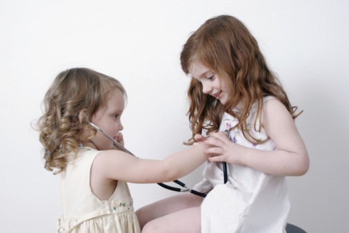 two little girls playing doctor