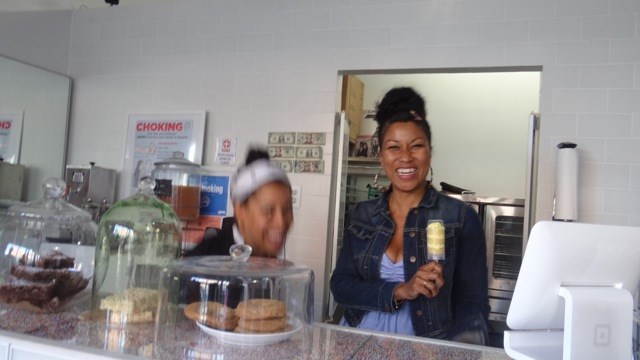 Akim Vann shows off one of the cupcake push up pops, while camera-shy Martine Dallemand tries to dodge the camera