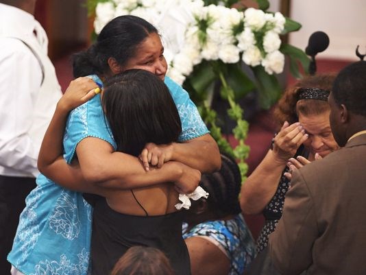 Family of Eric Garner mourns at his funeral Photo: USAToday