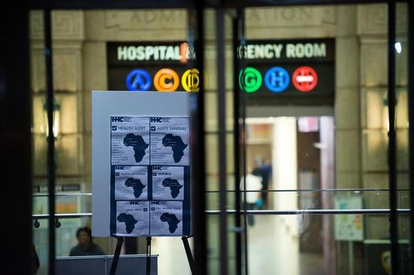 An Ebola Health Alert is posted outside of the entrance of Bellevue Hospital