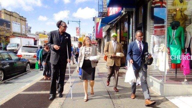 City Council Speaker Melissa Mark-Viverito (second from left) is accompanied by City Councilmember Robert Cornegy, Jr. and Michael Lambert, executive director of the BID for a stroll and tour of Fulton Street