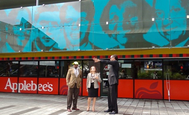 City Council Speaker Melissa Mark-Viverito (second from left) is accompanied by City Councilmember Robert Cornegy, Jr. and Michael Lambert, executive director of the BID end their tour of Fulton Street at Restoration Plaza