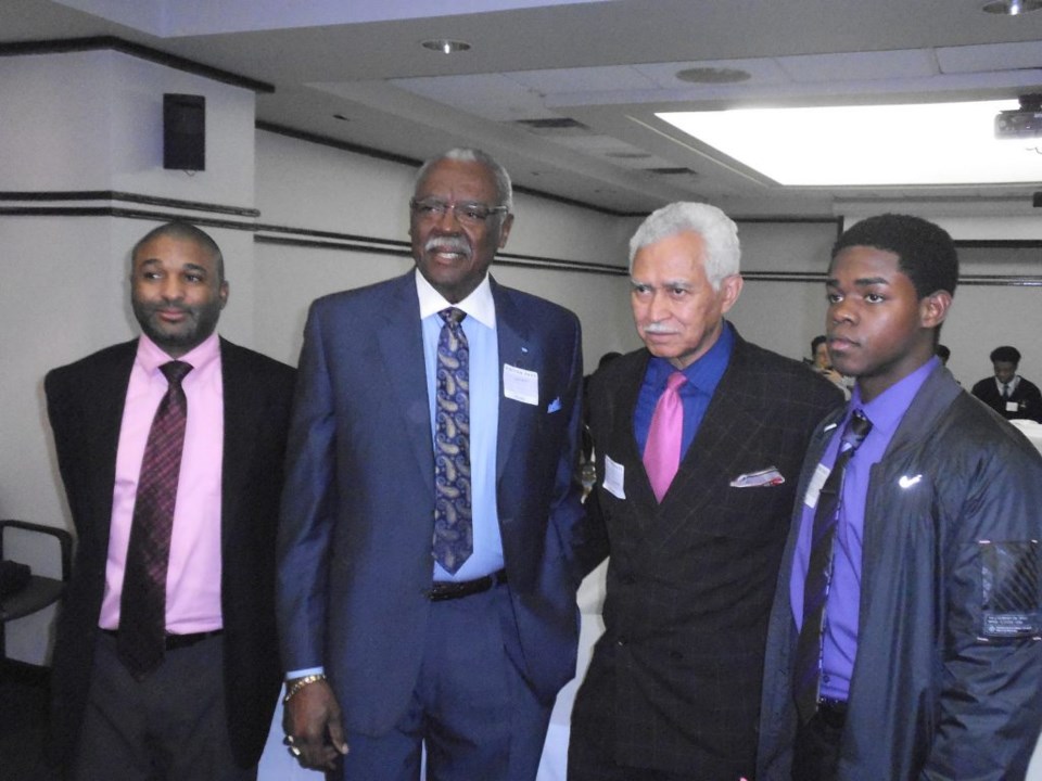 Consul Bernard Logodi of South African Consulate Free Holder Gerald W Owens and Founder Michael B White chat with Boys and Girls High student at  the Meet and Greet at the south African Consulate