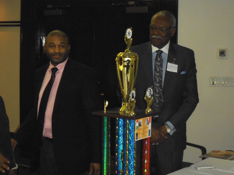 Consul Bernard Legodi of South Africa and Free Holder Board Member of Essex County admire World Leaders Trophy that was unveiled at meet and Greet.