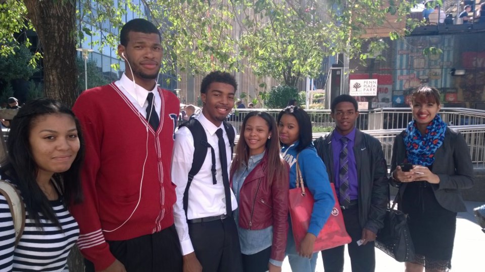 Students from Boys and Girls High get ready to enter the consulate