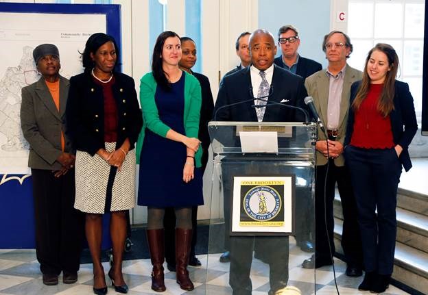 Brooklyn Borough President Eric L. Adams joins educators, community leaders and advocates in the rotunda of Brooklyn Borough Hall to urge teenagers to take advantage of a new state law that now allows them to become members of the City's community boards; he is joined by (from left to right) Brooklyn Community Board 16 Chair Bettie Kollock-Wallace, Brooklyn Borough Hall Chief Program Officer Sandra Chapman, Assembly Member Nily Rozic, Brooklyn Community Board 3 Chair Tremaine Wright, Al Kurland of PAL, Brooklyn Community Board 2 District Manager Robert Perris, Alan Schulman of ATSS/UFT, and Sarah Andes of Generation Citizen. Photo: Kathryn Kirk/Brooklyn BP's Office