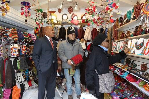 Brooklyn Borough President Eric L. Adams admires an assortment of wares being sold at the inaugural Holiday Market Village in Columbus Park.   Photo: Kathryn Kirk/Brooklyn BP's Office