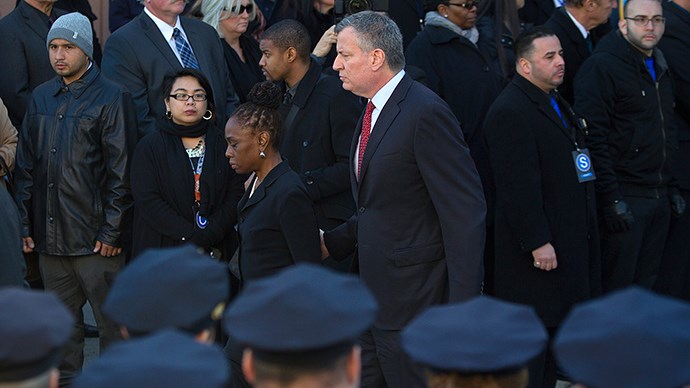 New York Ciy Mayor Bill de Blasio (C) and wife Chirlane McCray walk out of slain NYPD officer Rafael Ramos' funeral service at Christ Tabernacle Church in Queens  Photo: Reuters / Carlo Allegri
