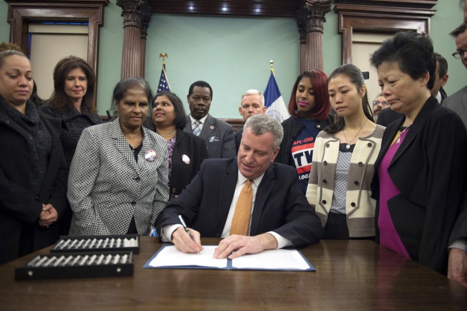NYC Mayor Bill de Blasio signs bill co-naming streets after slain NYPD Detectives Rafael Ramos and Wenjian Liu 