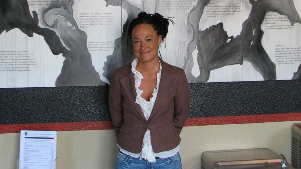 Rachel Dolezal, a leader of the Human Rights Education Institute, stands in front of a mural she painted at the institute's offices in Coeur d'Alene, Idaho. Photo: Nicholas K. Geranios/ AP Photo