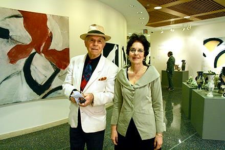 The actor, George Bartenieff, with Karen Malpede near one of Rowland's large abstract paintings at her 2013 retrospective show.
