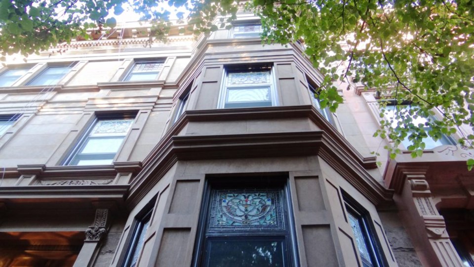 A view from outside 7 Arlington Place, the only home on the block that has maintained its original stained glass windows