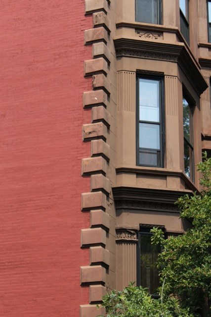 The brown colored sandstone on 'brownstones' in Park Slope, Brooklyn, is only a faccade, the walls beneath are red brick. Photographer, Sotero Bernal