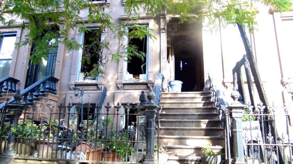  A fire Tuesday night destroyed a brownstone at 103 Hancock St, leaving two dead and two injured