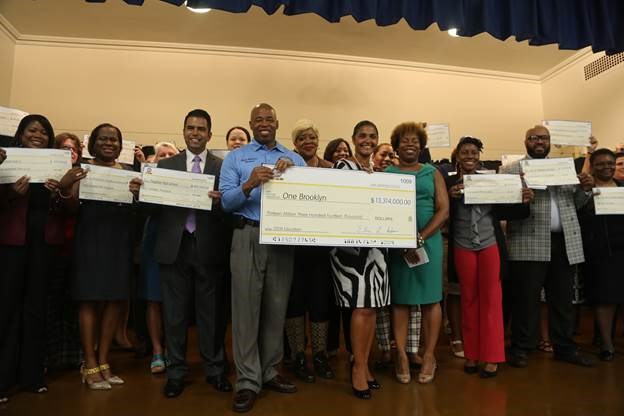 Brooklyn Borough President Eric L. Adams joins Deputy Brooklyn Borough President Diana Reyna, teachers, and school administrators from across Brooklyn in the auditorium of PS 193 Gil Hodges as he announced over $13 million invested in 70 schools throughout the borough; he held an oversized check made out to 