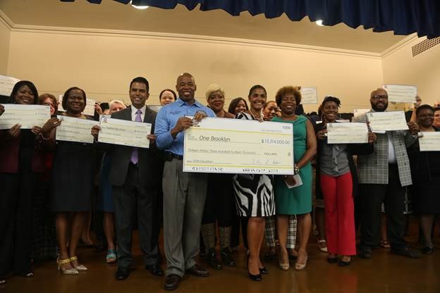 Brooklyn Borough President Eric L. Adams joins Deputy Brooklyn Borough President Diana Reyna, teachers, and school administrators from across Brooklyn in the auditorium of PS 193 Gil Hodges as he announced over $13 million invested in 70 schools throughout the borough; he held an oversized check made out to