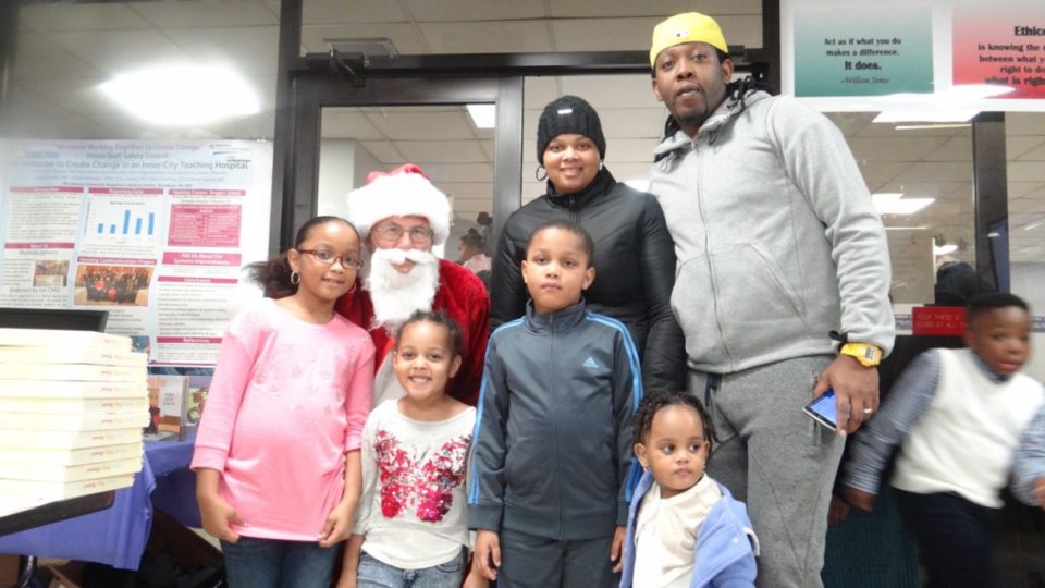 A family poses with Santa at the Brookdale Hospital Christmas Party