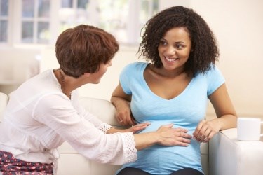 A new report from Choices in Childbirth adds to a body of evidence that doula care should be included in health plans and made available to all women, particularly women of color, who face disproportionate rates of maternal and infant mortality in the United States. Photo: Shutterstock 