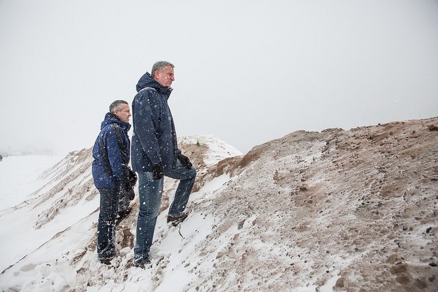 New York City Mayor Bill de Blasio stands with the Director of The Mayor's Office of Recovery and Resiliency, Daniel Zarrilli on a temporary sand berm which was built to protect against storm surge flooding on the beach at Coney Island during a major snowstorm on Saturday, January 23, 2016. Michael Appleton/Mayoral Photography Office