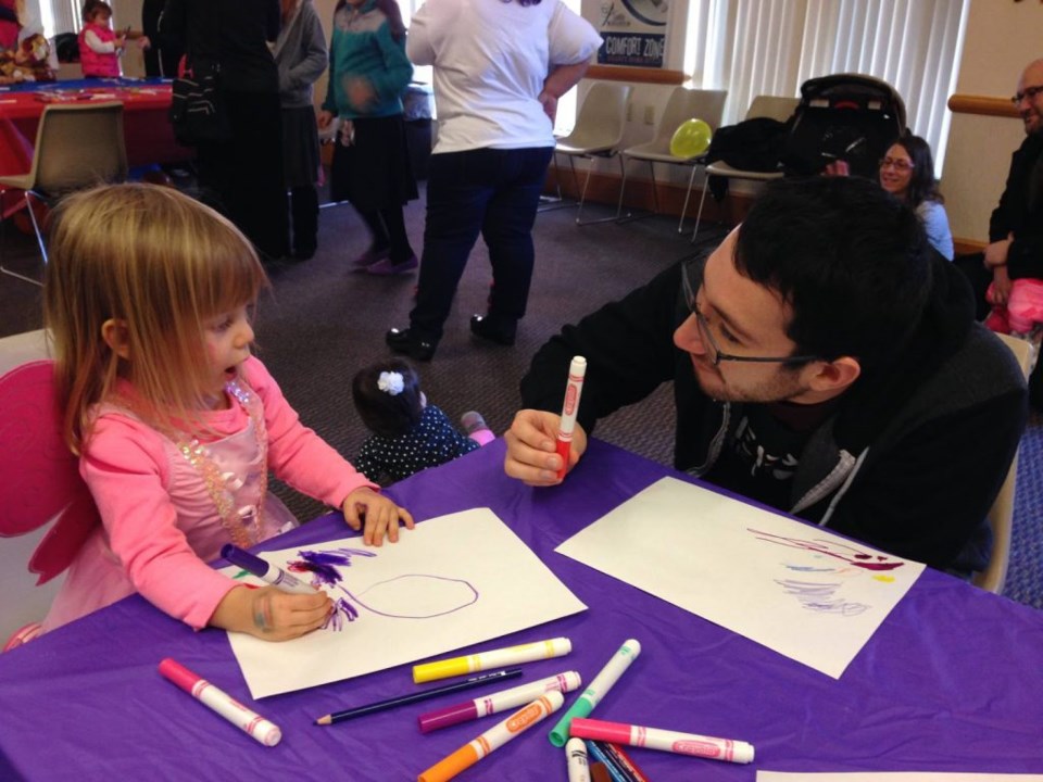 Sam Sittenfield volunteering at a community center. Photo by: Becca Suffrin