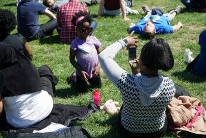 Time to relax waiting for Bernie to speak. (Photo by Matt Weinstein)