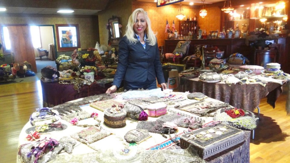 Dolly Williams, surrounded by the hundreds of accessories she has hand-sewn.