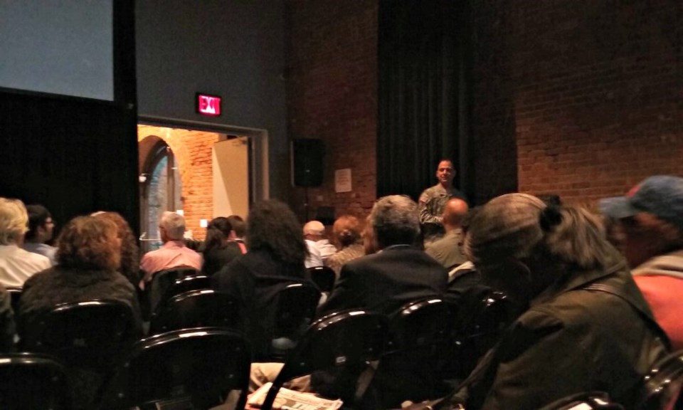 A committee member poses a question.