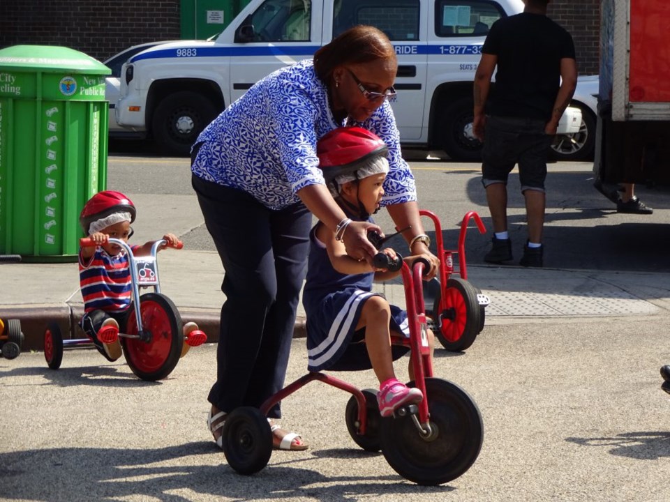 Trike-a-thon, Young Minds Preschool, Carolie Mills, FAB Alliance, Putnam Triangle Plaza, tricycles, bicycles, safety, Clinton Hill, Brooklyn Public Library, Pop-up Reading Room