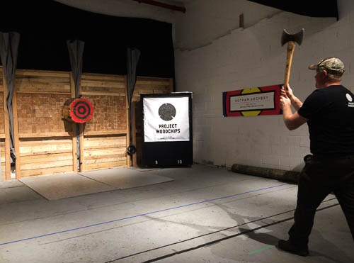 Brett demonstrates axe-throwing